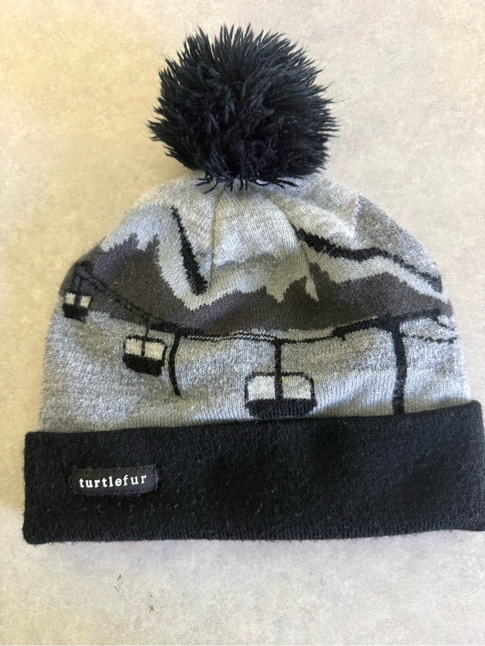 Turtle Fur Kids Gondola Ski Lift Winter Scene Pom Beanie Hat Gray & Black